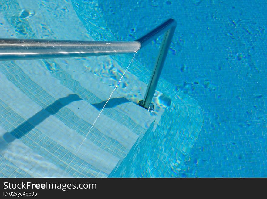 Steps and handrail of a swimming pool