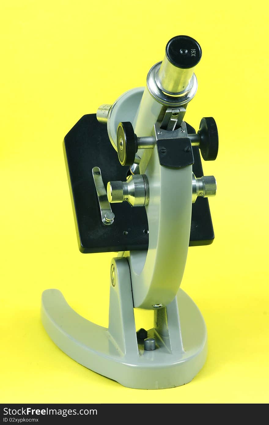 Microscope on a yellow background