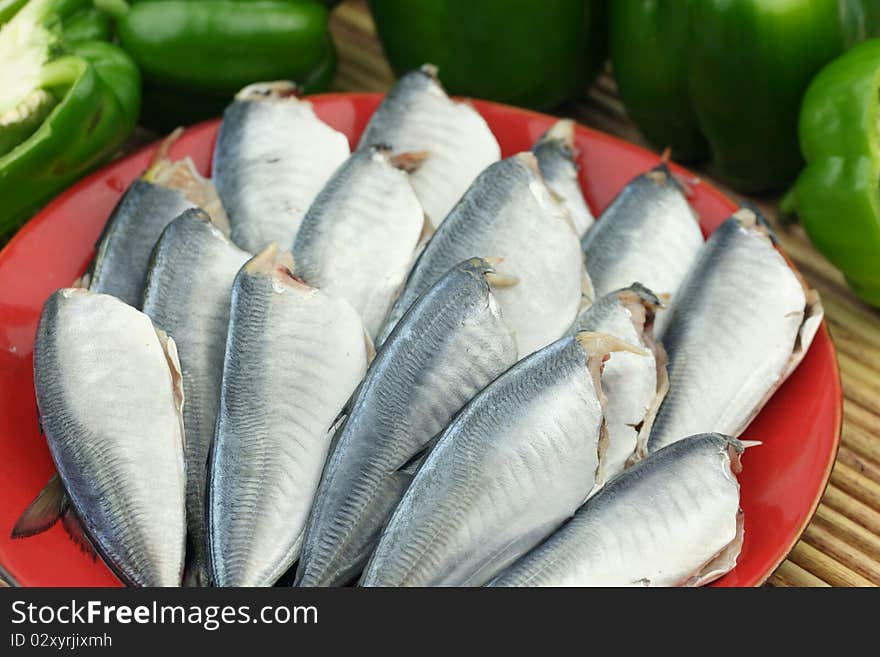 A dish of fresh fishes on white