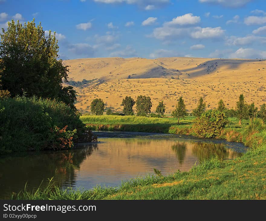 Summer Landscape with Stream with trees and grass, blue sky with white clouds. Summer Landscape with Stream with trees and grass, blue sky with white clouds