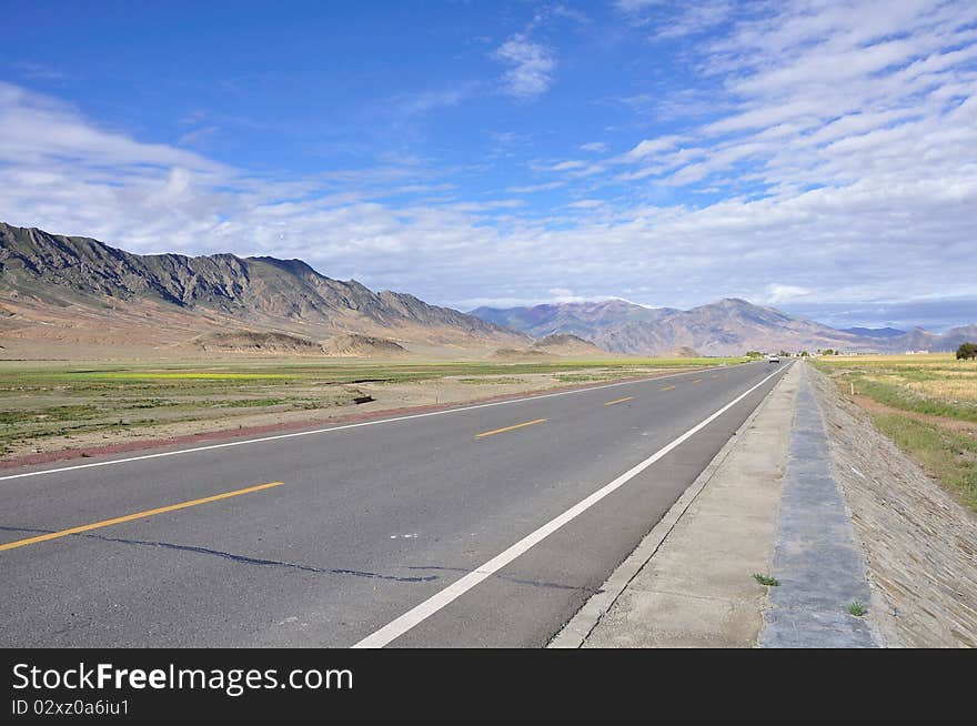 The highway of tibet is wide,open and opaque.What a beautiful landscape. The highway of tibet is wide,open and opaque.What a beautiful landscape.