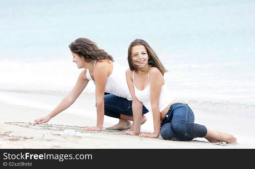 Young Happy Girls On Beach