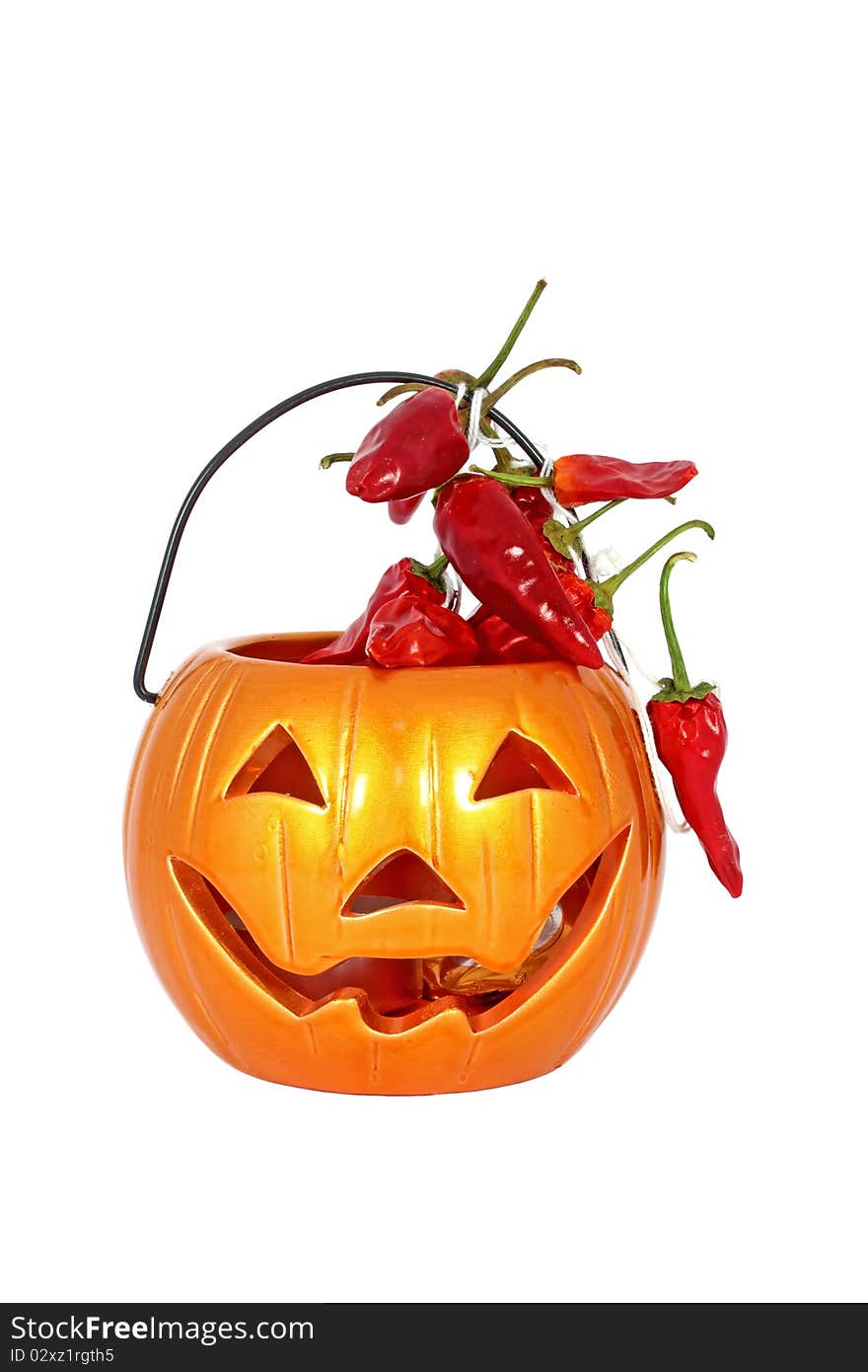 Little halloween lamp with red chilly pepper isolated on white