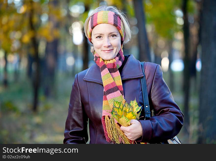 Young woman in autumn park