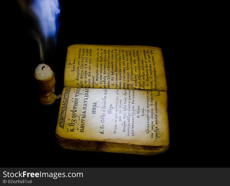 Prayer Book by candlelight in the shade.