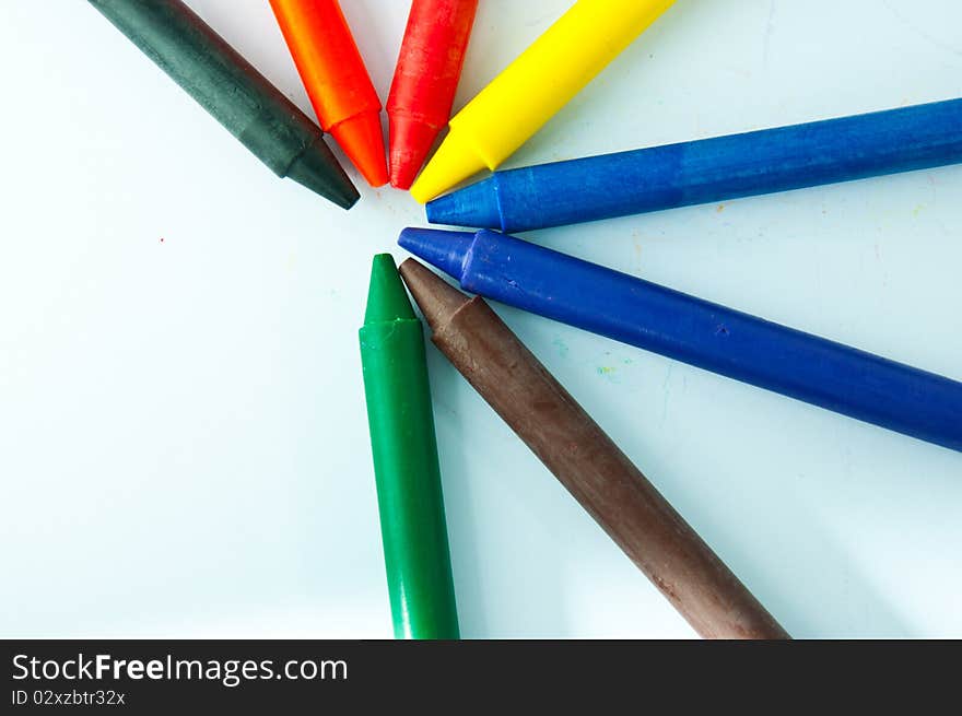 Colorful crayons on white background