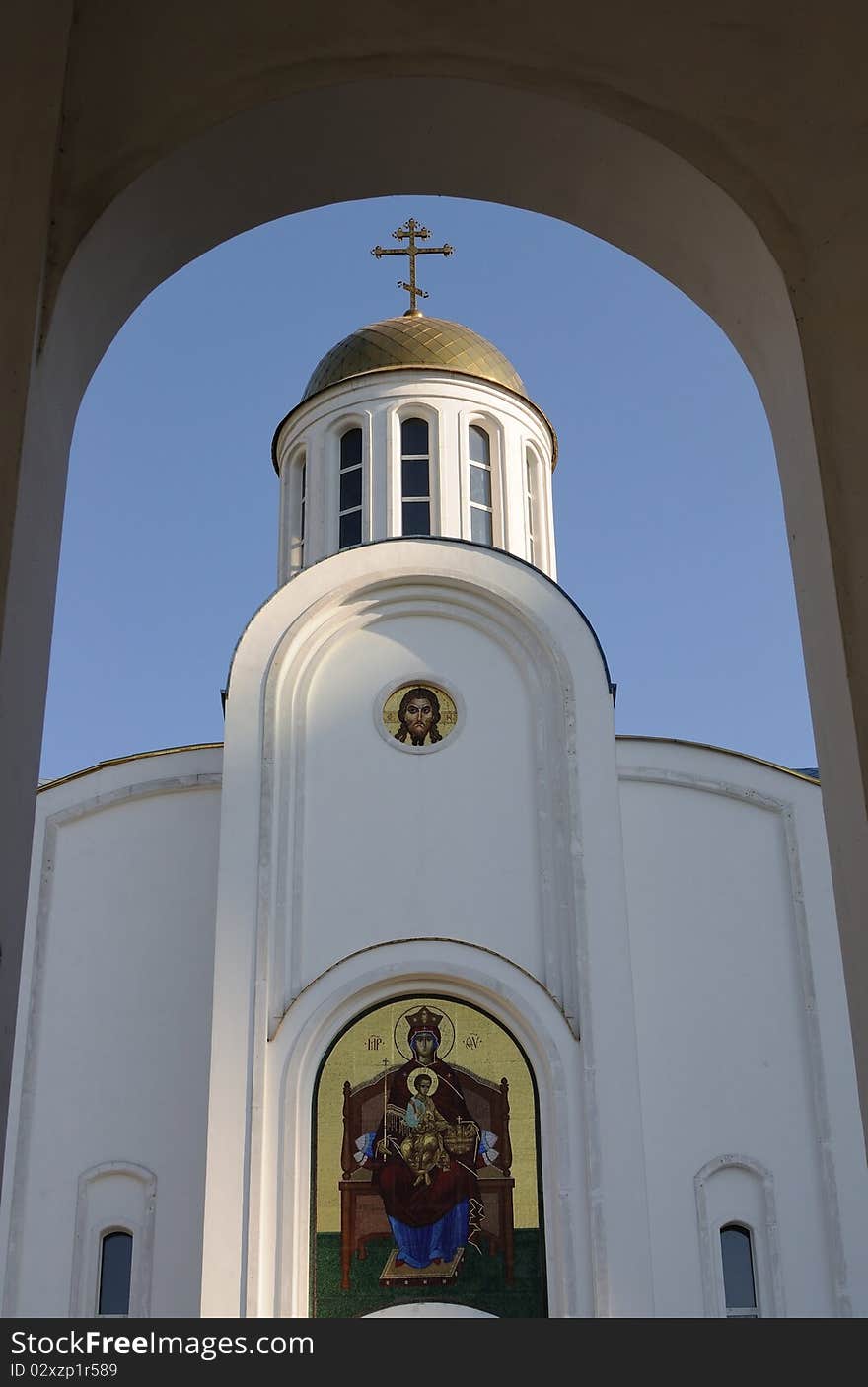 White orthodox church - arch of the chapel forms a beautiful frame