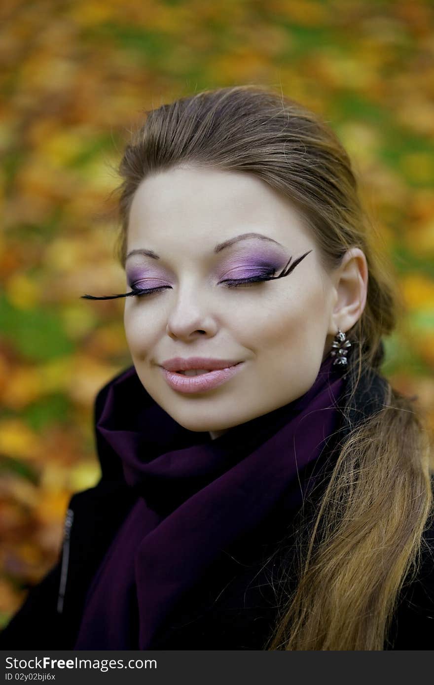 Beautiful girl in the autumn park