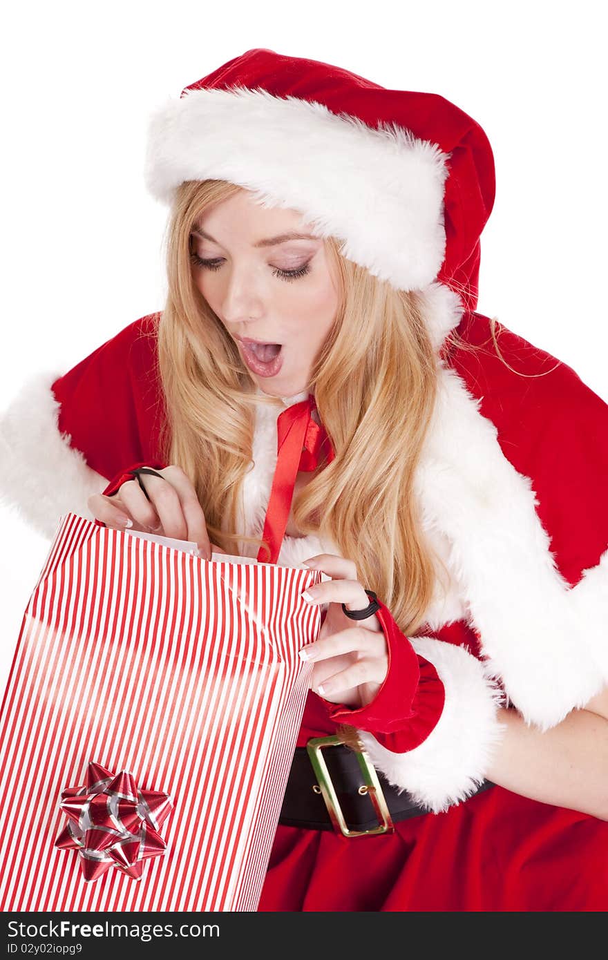 Mrs Santa is opening a gift with a surprised expression on her face. Mrs Santa is opening a gift with a surprised expression on her face.