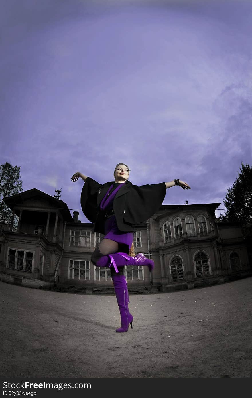 Woman in the background of an old building