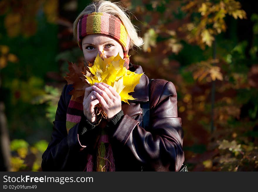 Young woman in autumn park