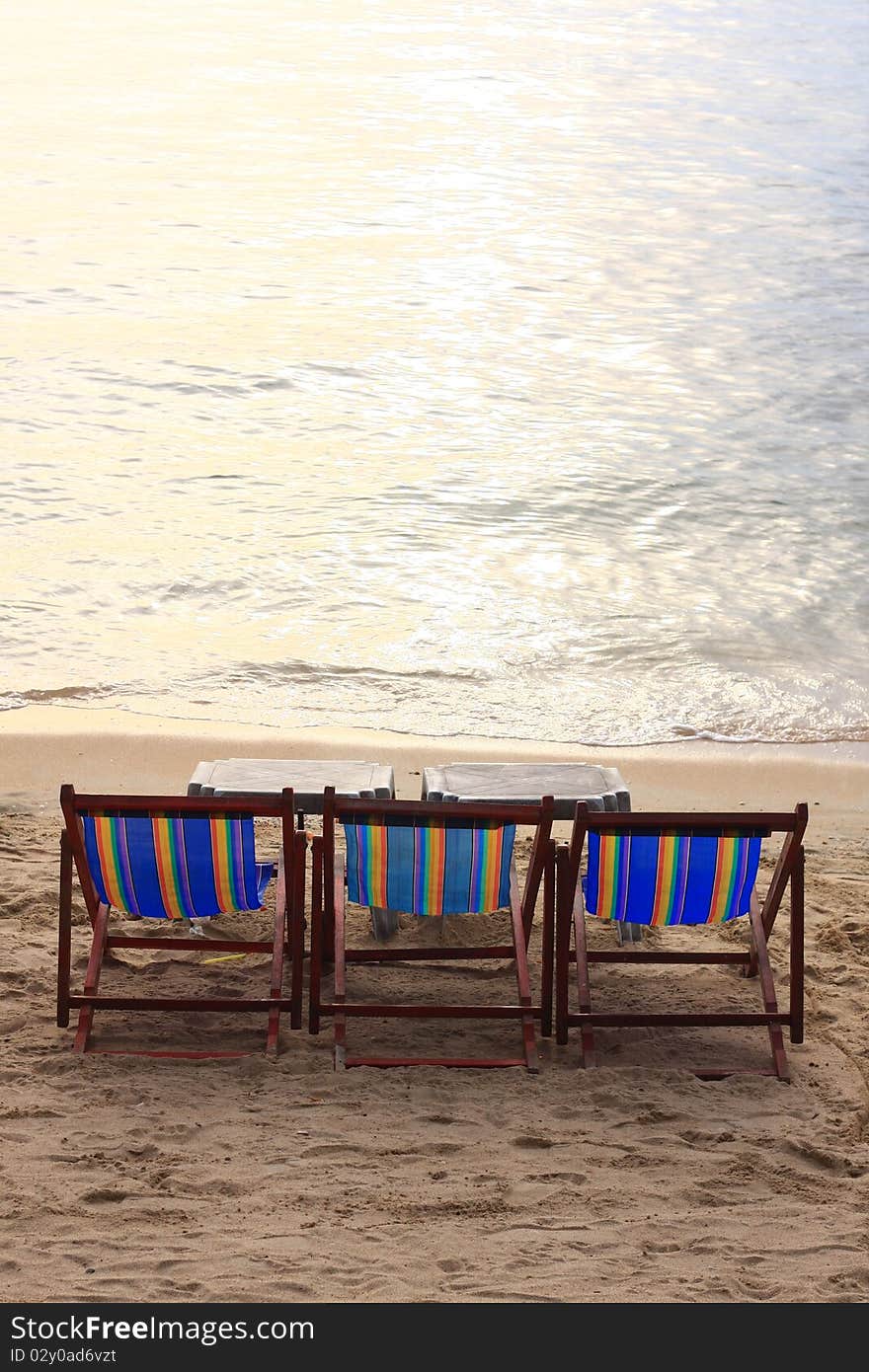 The wood long chair on the beach. The wood long chair on the beach