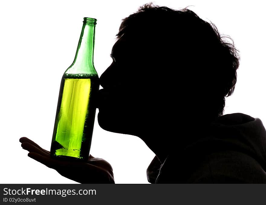 Man kissing bottle of beer