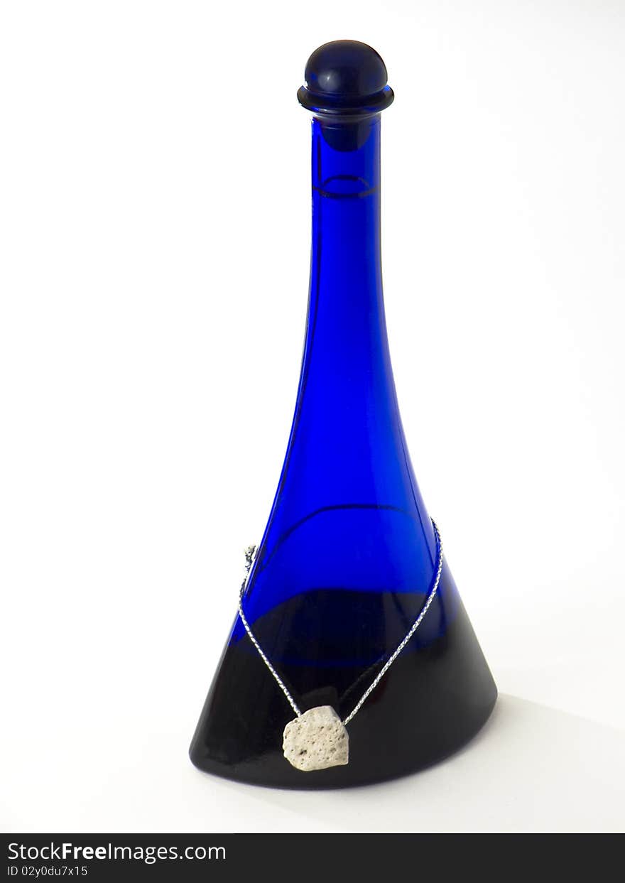 Blue bottle with a stone