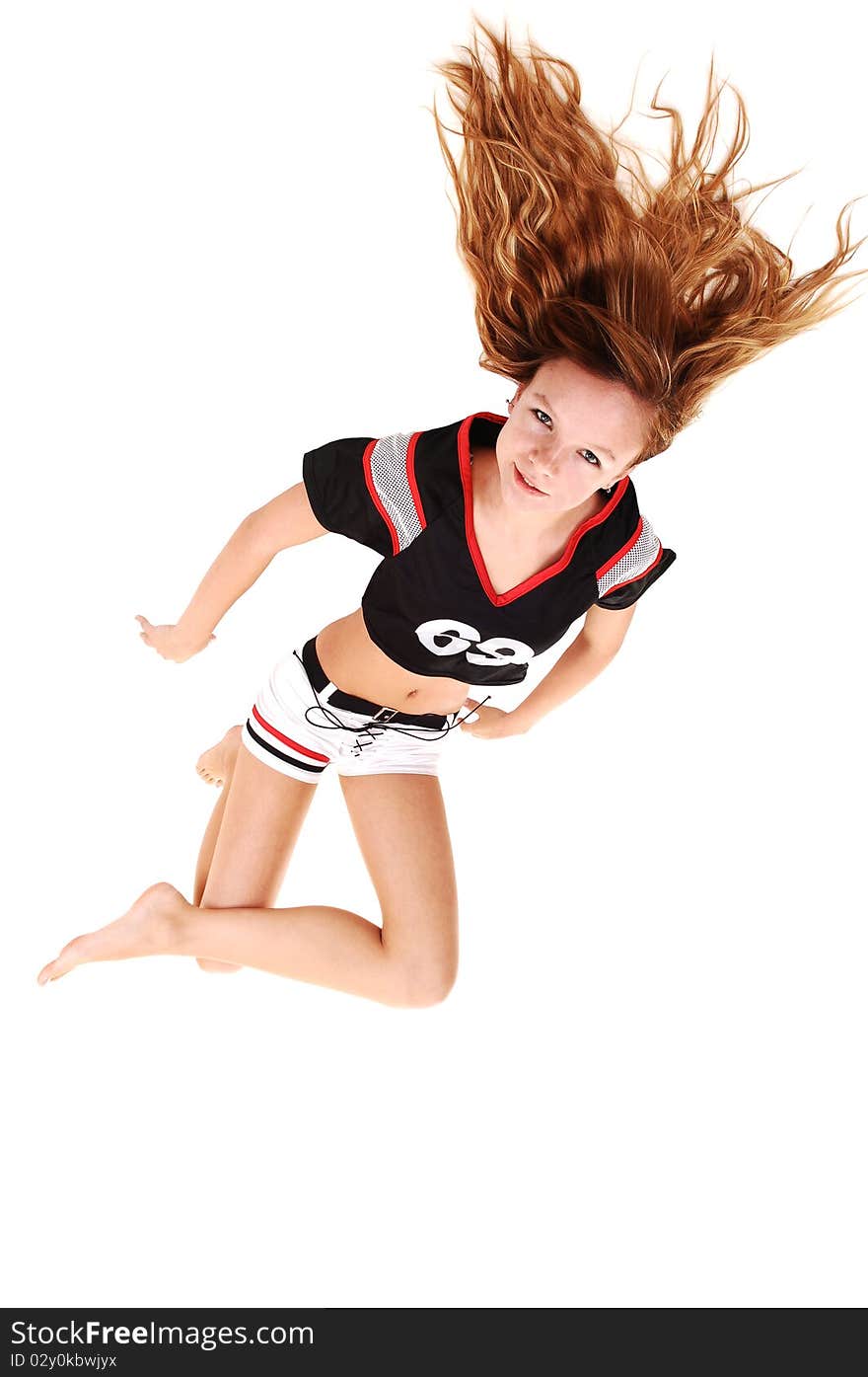 A young teenage soccer girl lying on the floor in her uniform,
for a portrait in the studio, over white background. A young teenage soccer girl lying on the floor in her uniform,
for a portrait in the studio, over white background.