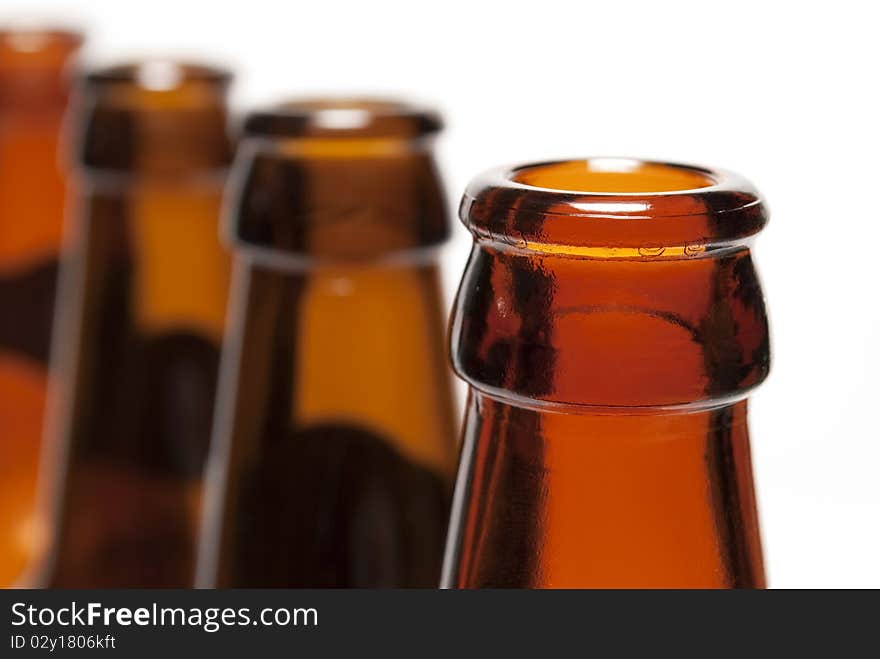 Brown bottle placement in a row on a white background