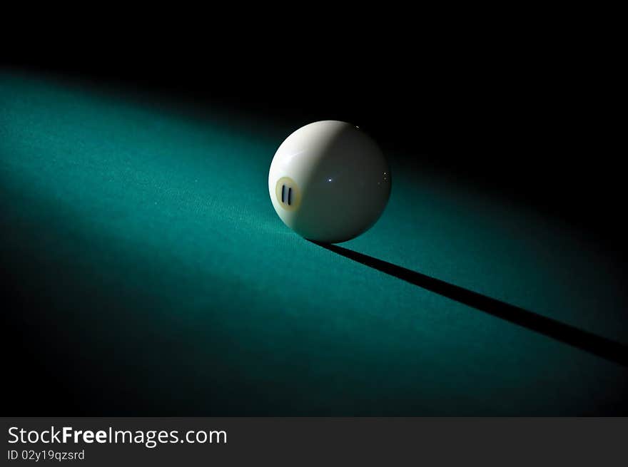 Billiard ball on green linen