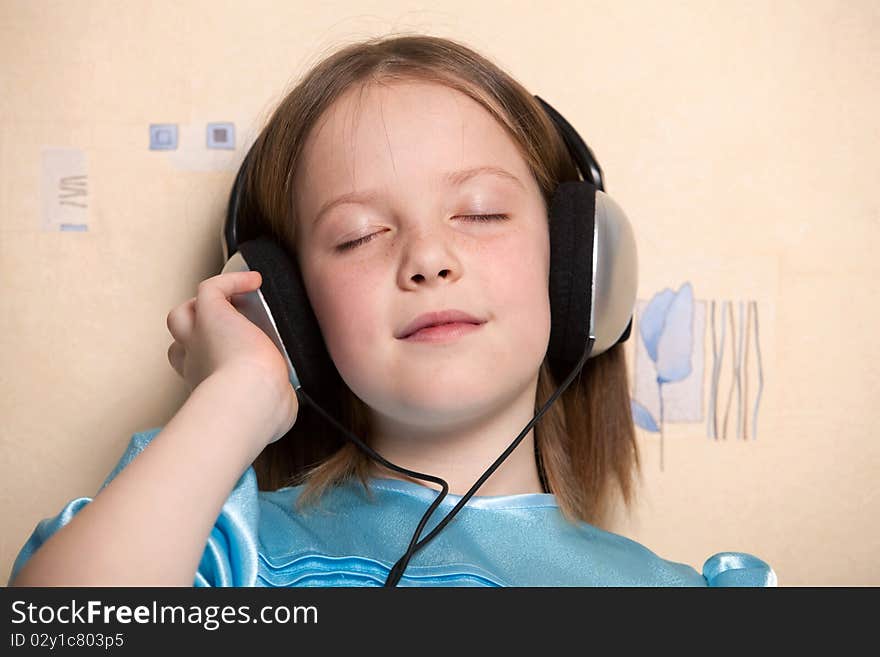 Eight year old girl listening music