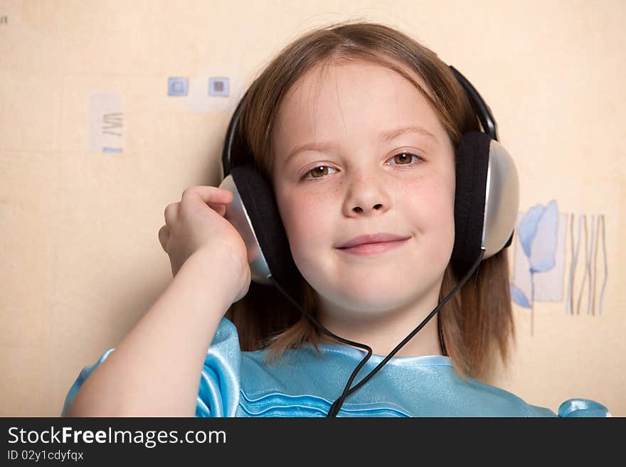 Eight year old girl listening music