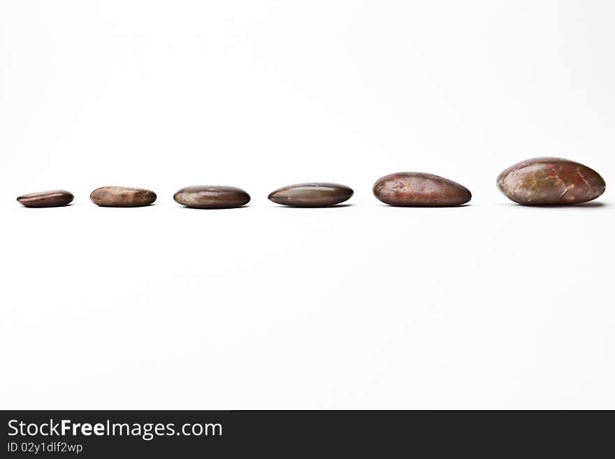 A shot of river pebbles in a strait formation.