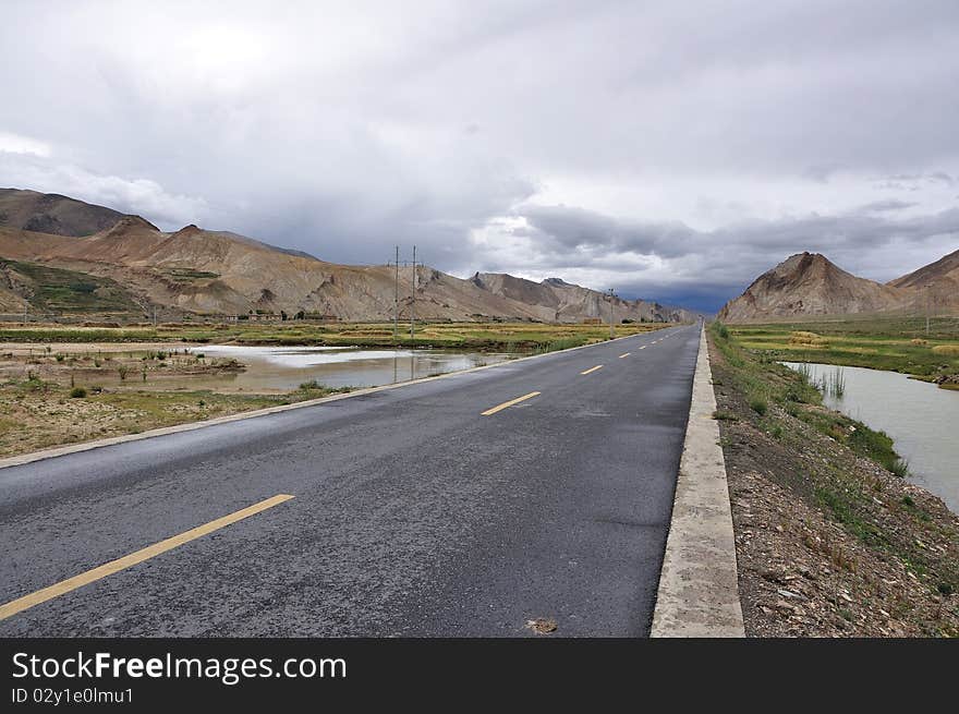 The highway of tibet is wide,open and opaque.What a beautiful landscape. The highway of tibet is wide,open and opaque.What a beautiful landscape.