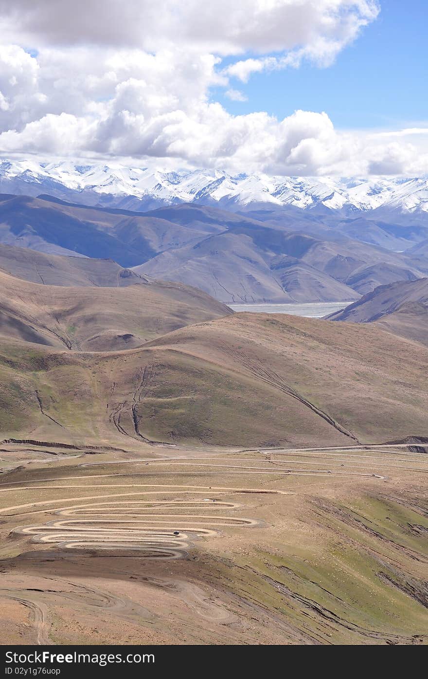 This road is very tortuous.What a beautiful landscape.the south, as white is embedded in the horizon of snow-capped. This road is very tortuous.What a beautiful landscape.the south, as white is embedded in the horizon of snow-capped