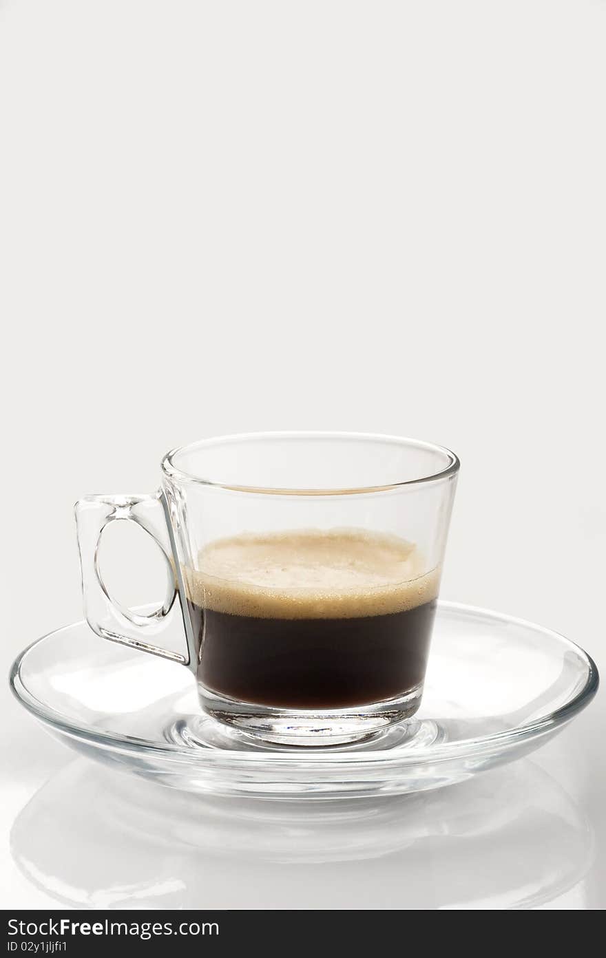 A cup of coffe espresso on white. A cup of coffe espresso on white