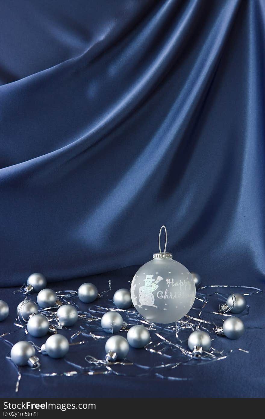 Satin background with Christmas decorations; place for your object. Satin background with Christmas decorations; place for your object