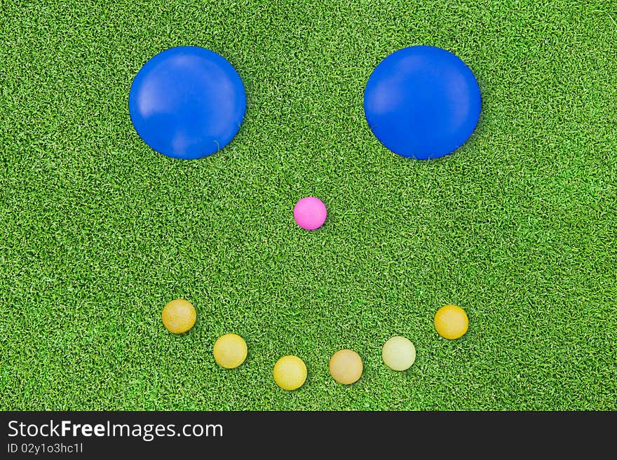 Concept image beautiful green grass texture from golf course with smile. Concept image beautiful green grass texture from golf course with smile