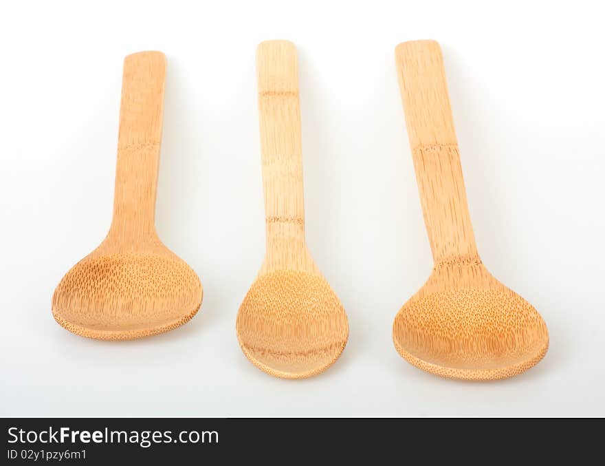 Set of wooden kitchen cooking spoons on a white background. Set of wooden kitchen cooking spoons on a white background