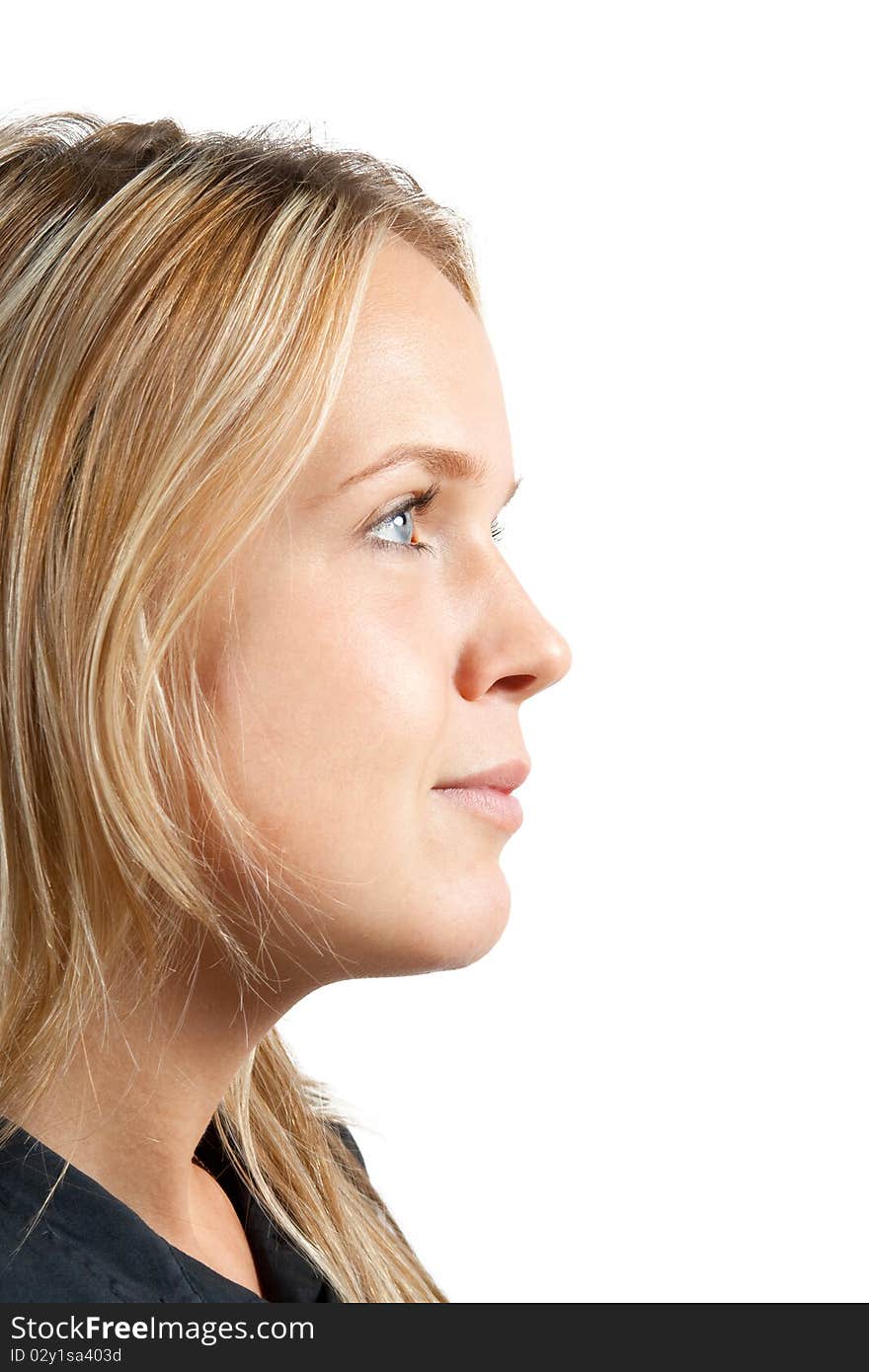 Profile portrait of a young woman on white background