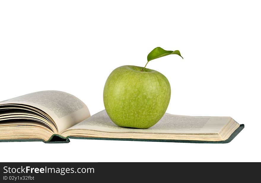 Apple on open book