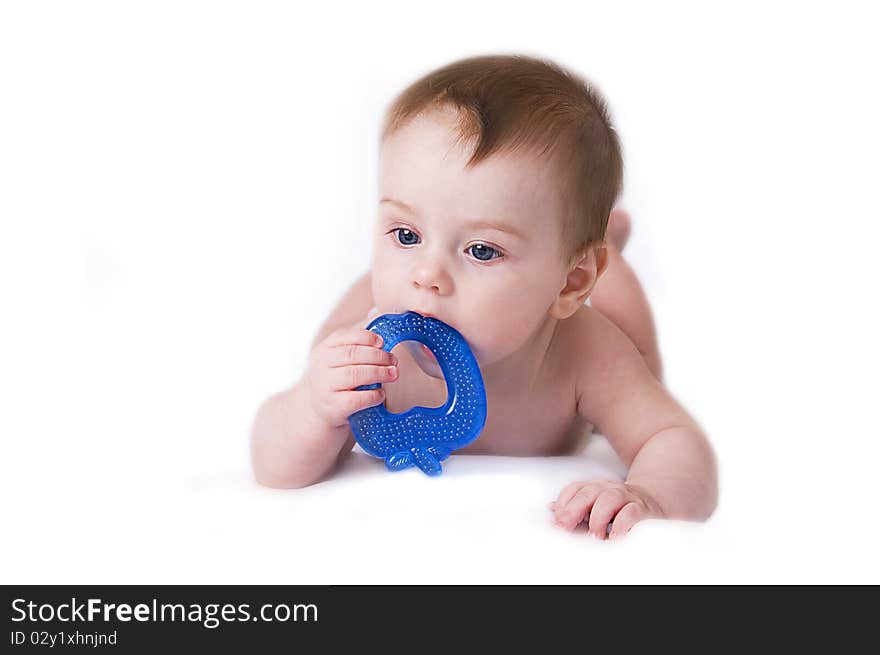 Beautiful baby lying on a white background