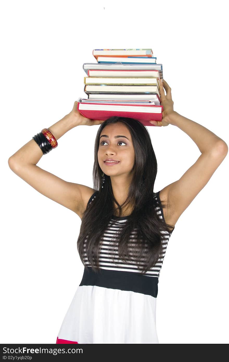 Young teenage girl holding books. Isolated on a white background.