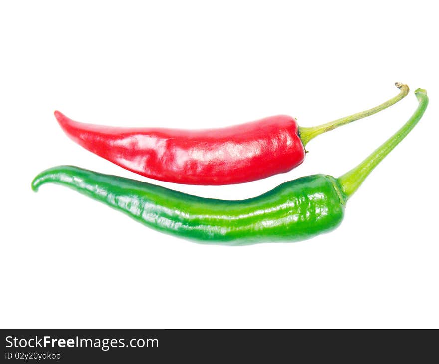 Red and green peppers isolated on white