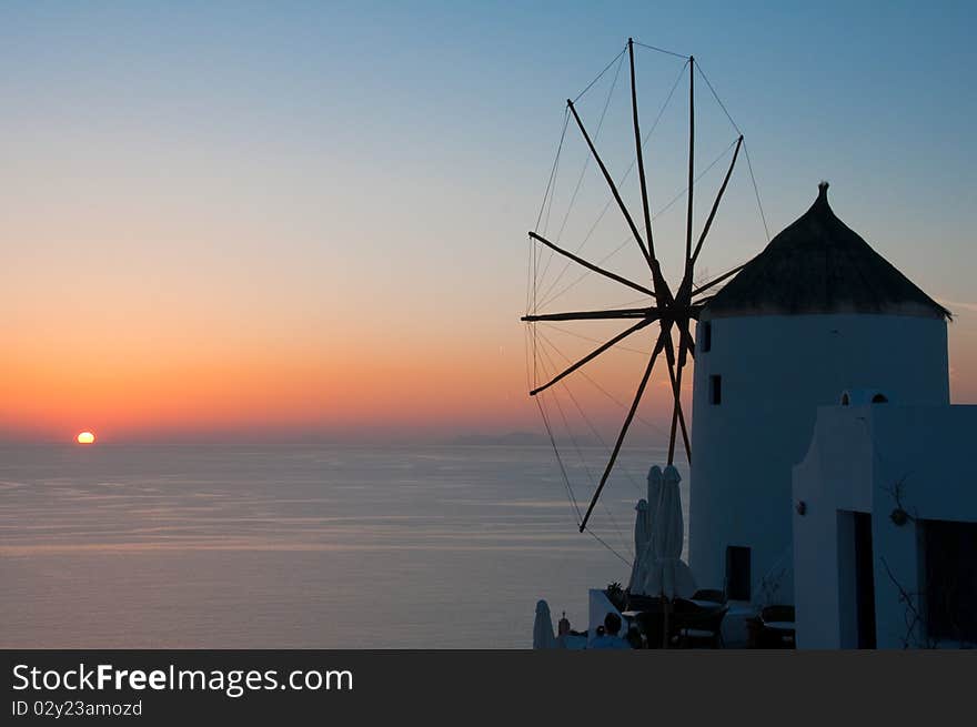 Windmill in a sunset at Oia, Santorini. Windmill in a sunset at Oia, Santorini