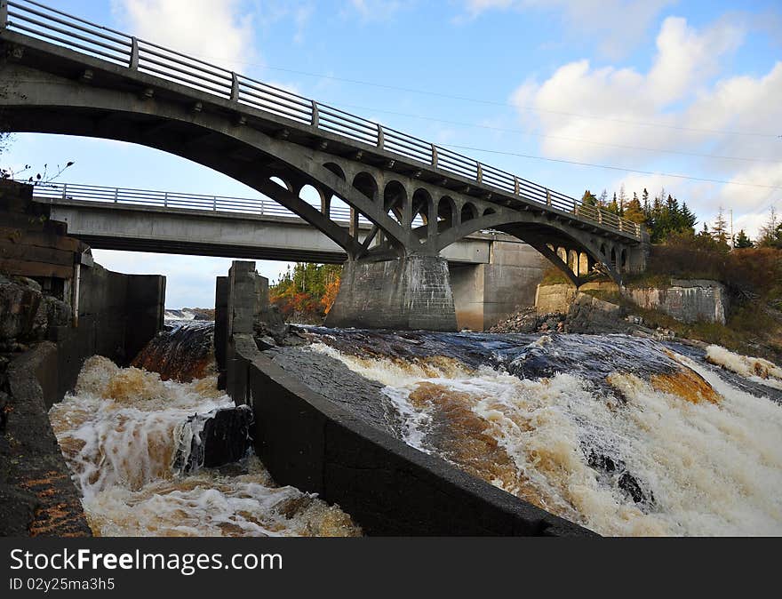 This rapid running river in Newfoundland proved to difficult for spawning salmon to navigate. A special salmon ladder [shown on the left] was designed to allow salmon to get over the falls and continue on to their spawning grounds. This rapid running river in Newfoundland proved to difficult for spawning salmon to navigate. A special salmon ladder [shown on the left] was designed to allow salmon to get over the falls and continue on to their spawning grounds.