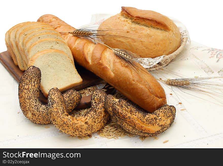 Group of different bread products on white