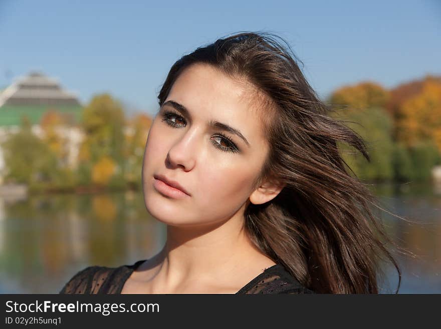 Portrait of the nice girl in autumn park. Portrait of the nice girl in autumn park