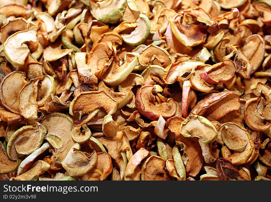 Background with the dried cut apples. A meal theme.