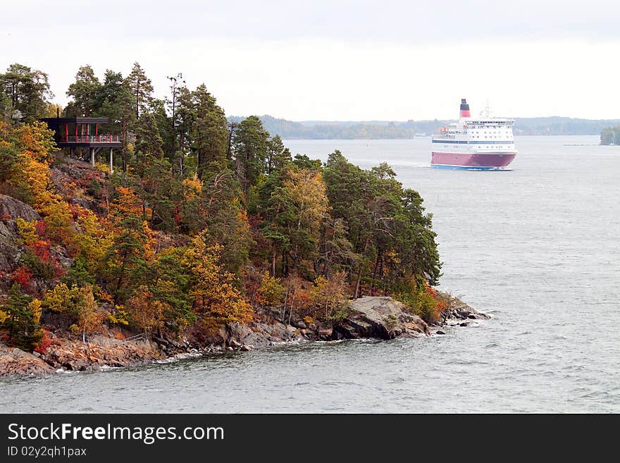 Autumn Swedish canal with ship