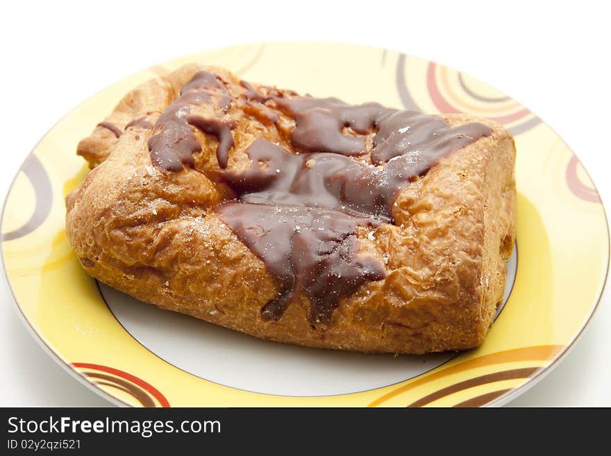 Pastry with chocolate filling and onto plates