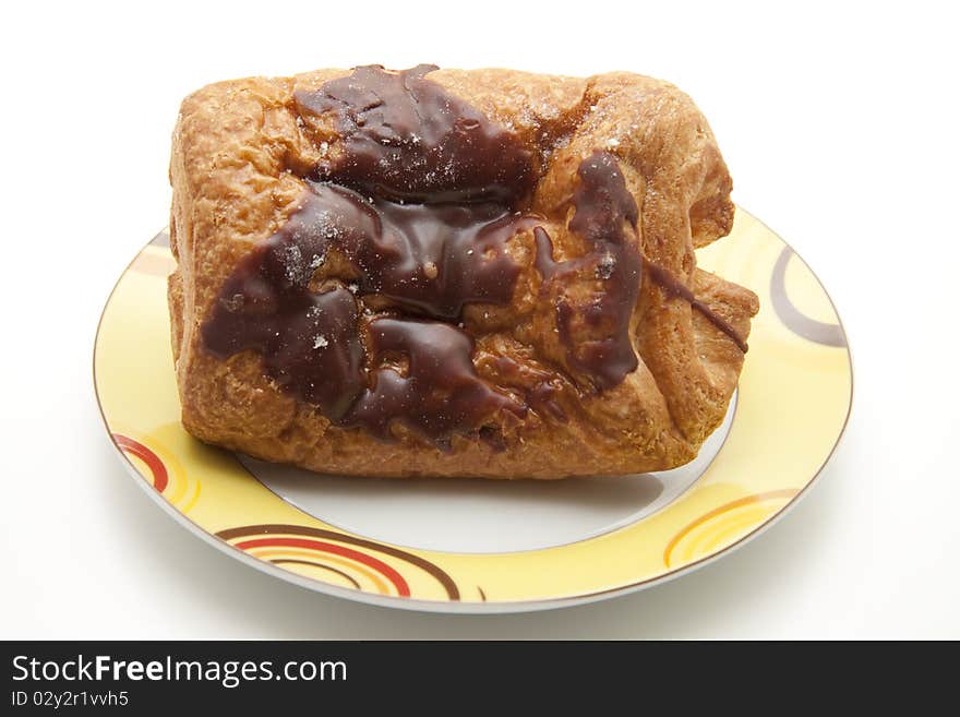 Pastry with chocolate filling and onto plates