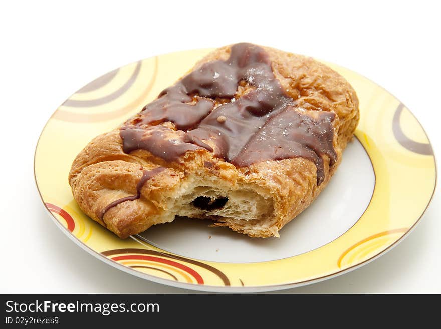 Pastry with chocolate filling and onto plates