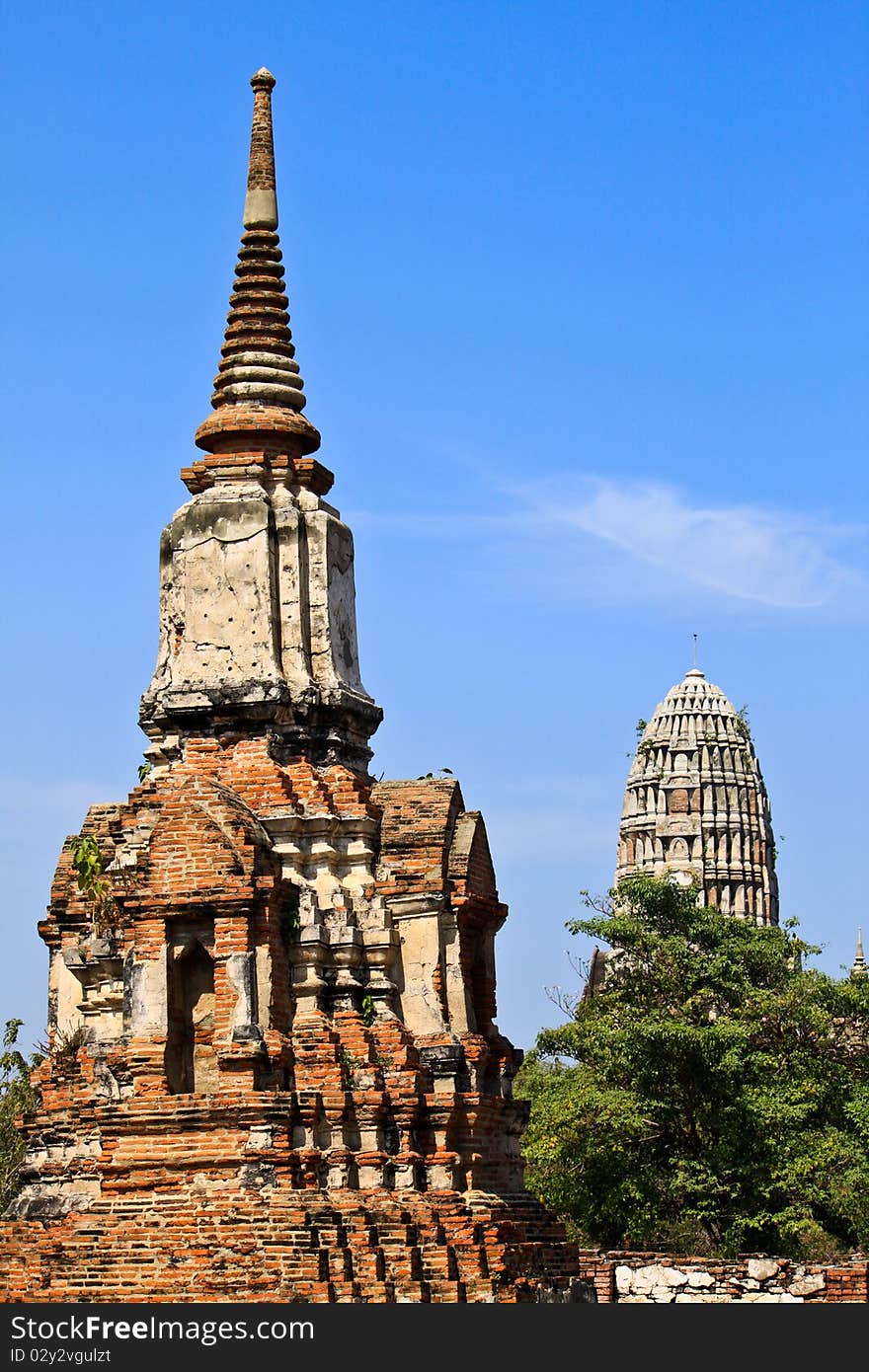 The ancient pagoda and blue sky in Thailand. The ancient pagoda and blue sky in Thailand