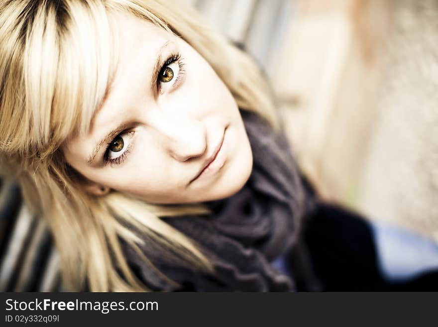 Young beautiful blonde staring at camera from below