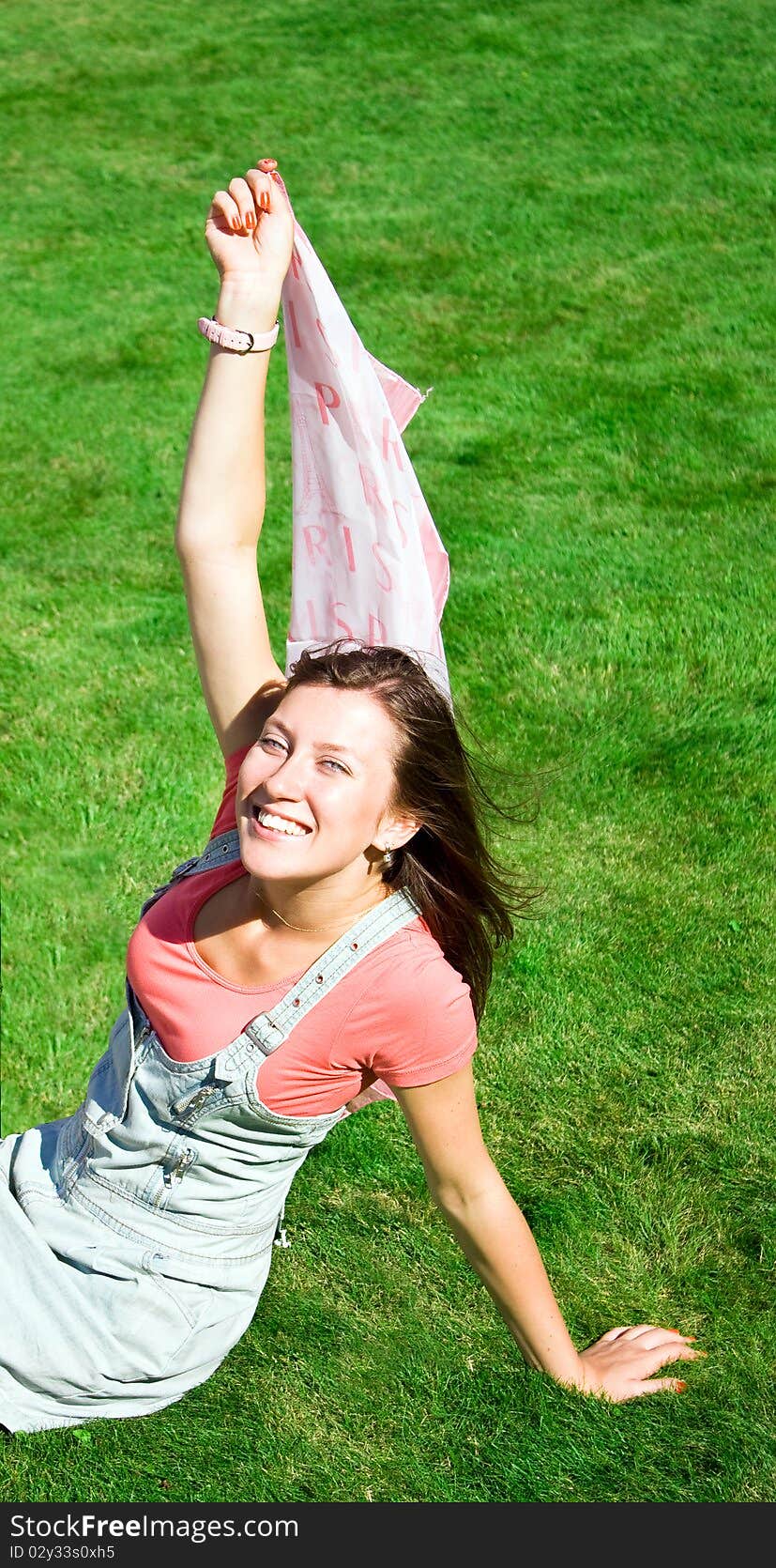 Happy young brunette with a handkerchief resting