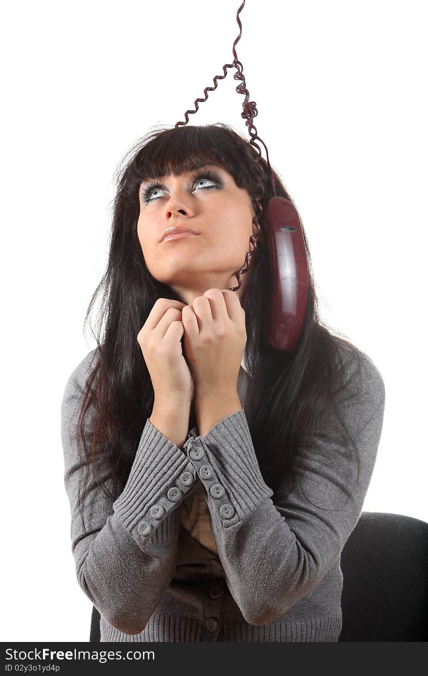 Tired young businesswoman try to hang herself on the phone wire. Tired young businesswoman try to hang herself on the phone wire