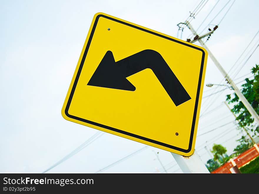 Turn left direction yellow traffic sign symbol. Turn left direction yellow traffic sign symbol