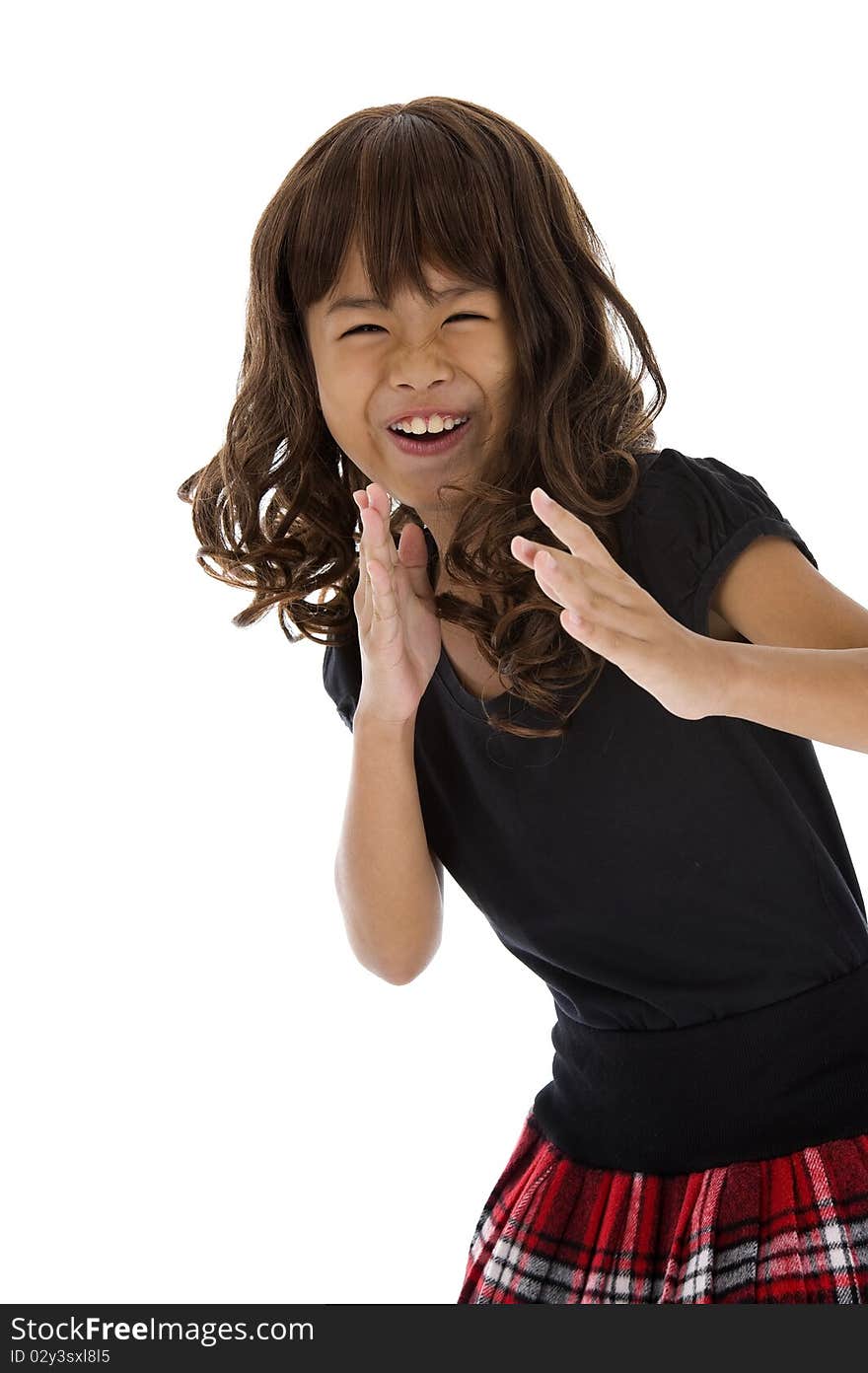 Cute girl in karate pose, isolated on white background